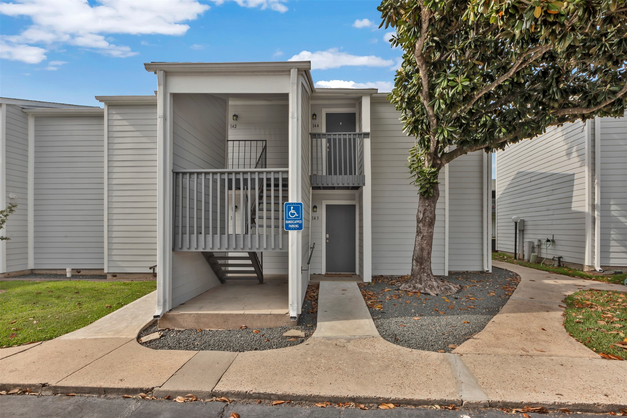 13151 Walden Road, Unit 142 Montgomery, TX 77356 - Photo 30 of 50 a view of a house with a porch
