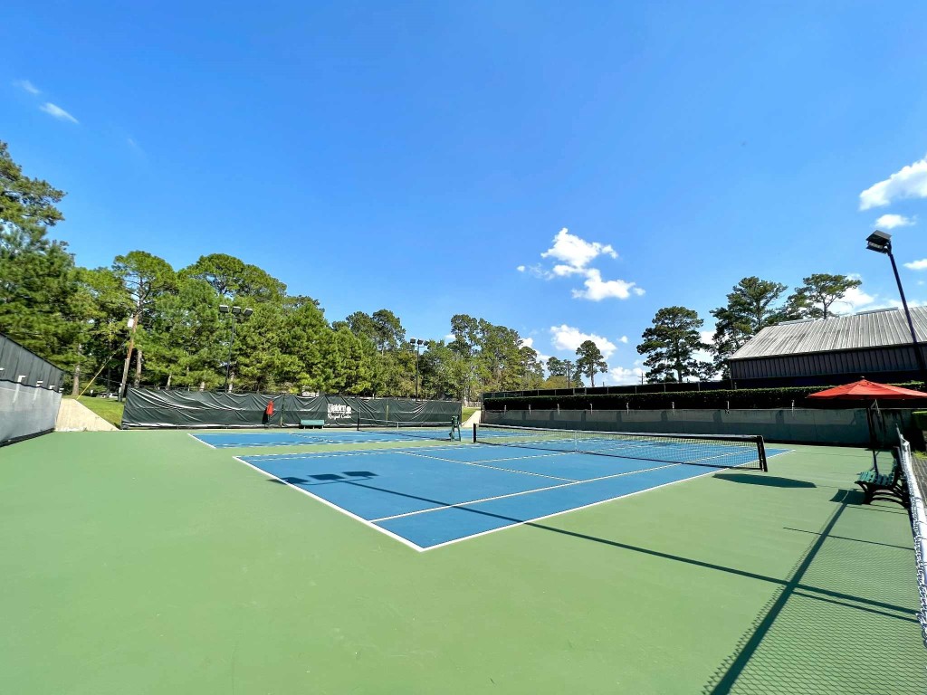 13151 Walden Road, Unit 142 Montgomery, TX 77356 - Photo 32 of 50 a view of a tennis court