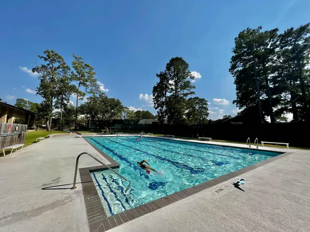 a view of a backyard patio and swimming pool