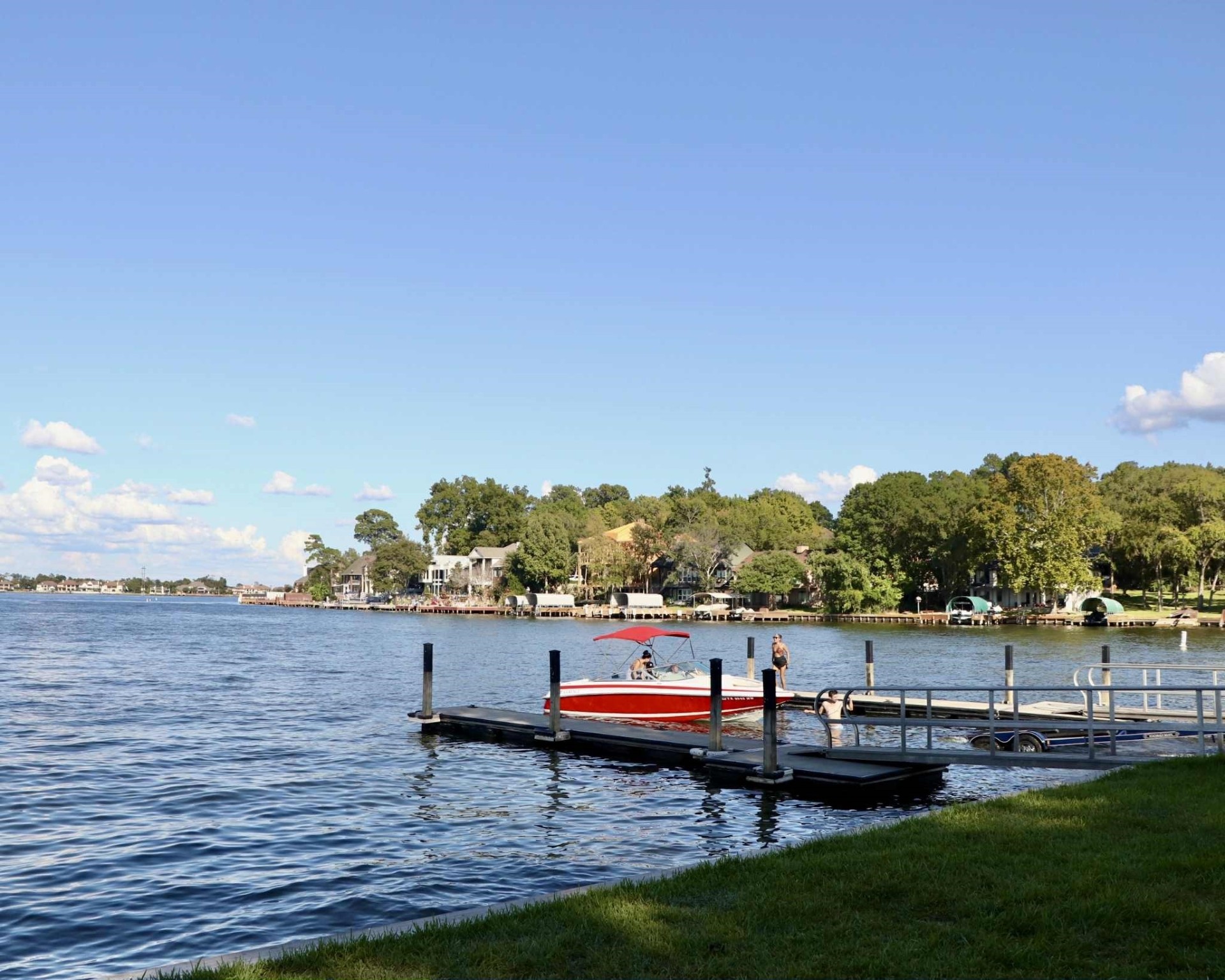 13151 Walden Road, Unit 142 Montgomery, TX 77356 - Photo 45 of 50 a view of a lake with houses in the back