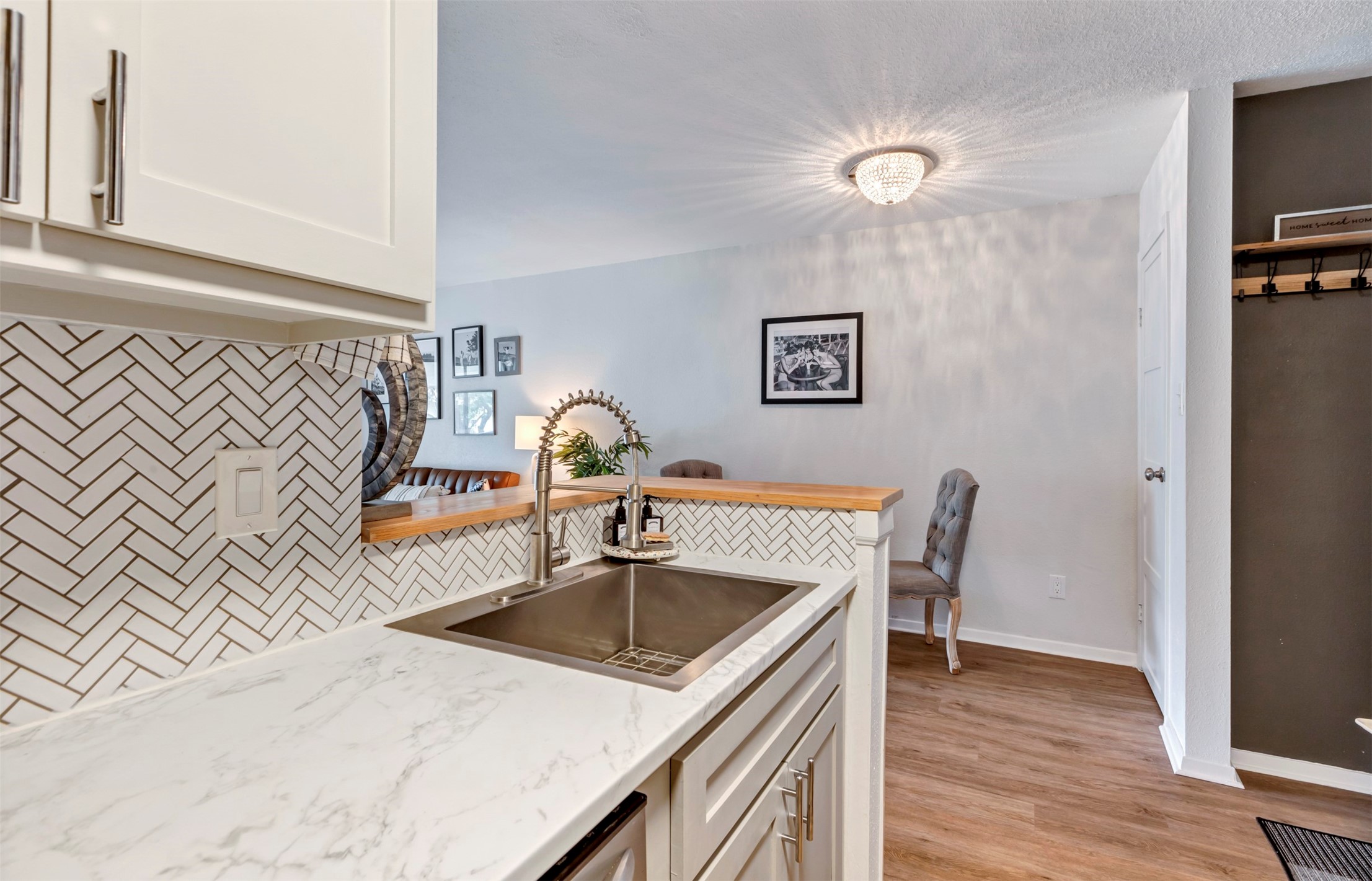 13151 Walden Road, Unit 142 Montgomery, TX 77356 - Photo 10 of 50 a kitchen with a table chairs and a wooden floor