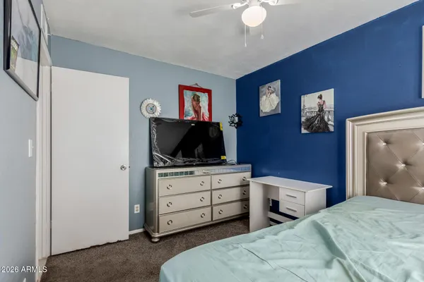 a bedroom with a bed and a closet