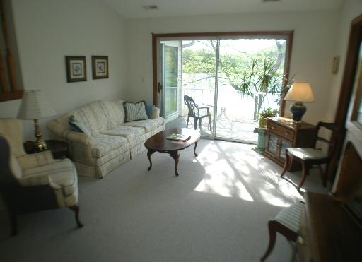 -n212 Windermere Road, Unit 2808 Winfield, IL 60190 - Photo 2 of 9 a living room with furniture and a large window