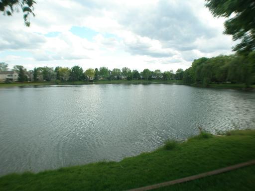 -n212 Windermere Road, Unit 2808 Winfield, IL 60190 - Photo 9 of 9 a view of a lake next to a yard