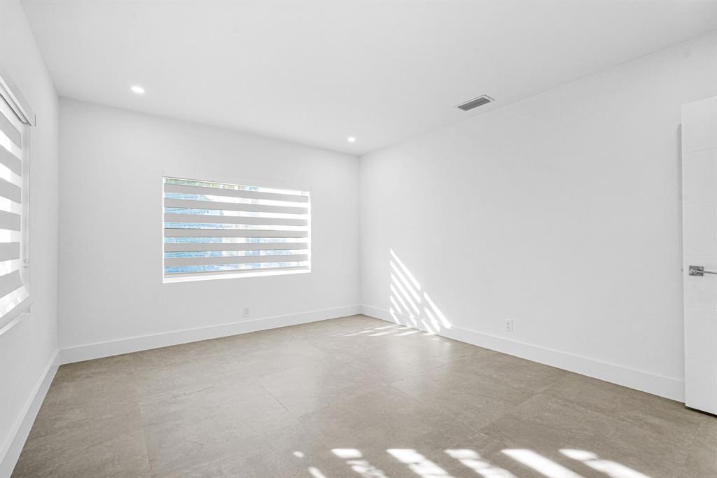 2291 Southwest 17th Street Miami, FL 33145 - Photo 38 of 86 an empty room with wooden floor and windows