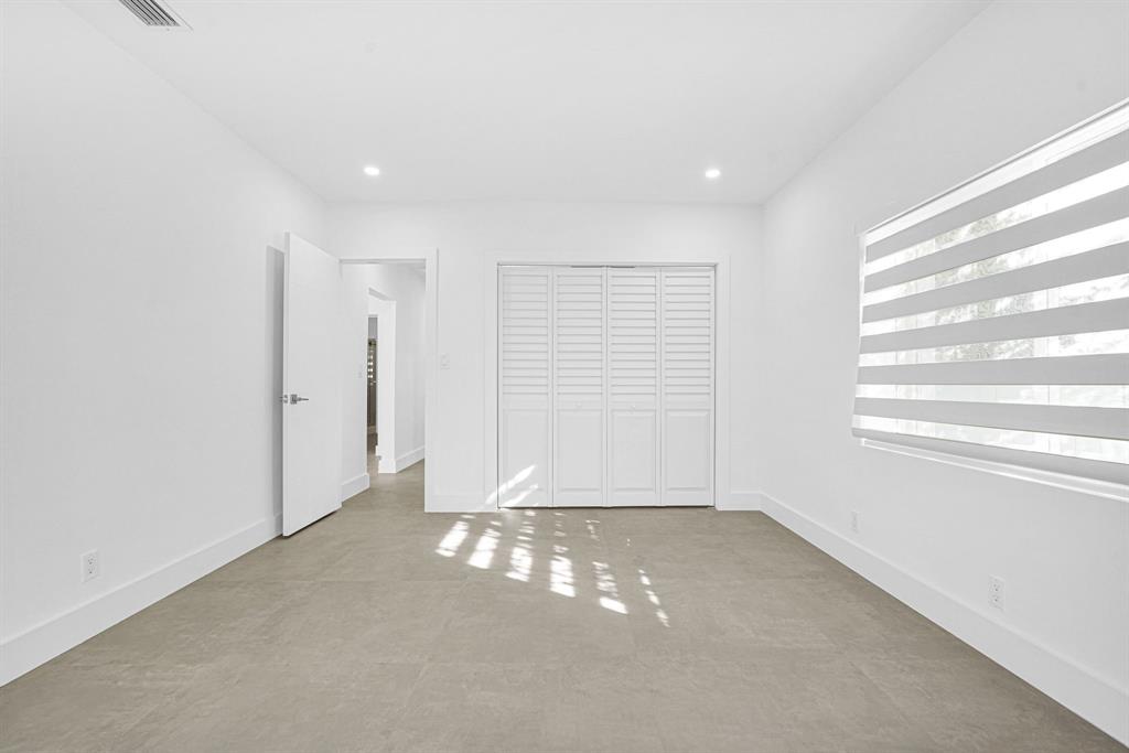 2291 Southwest 17th Street Miami, FL 33145 - Photo 40 of 86 a view of a livingroom with an empty space and a window