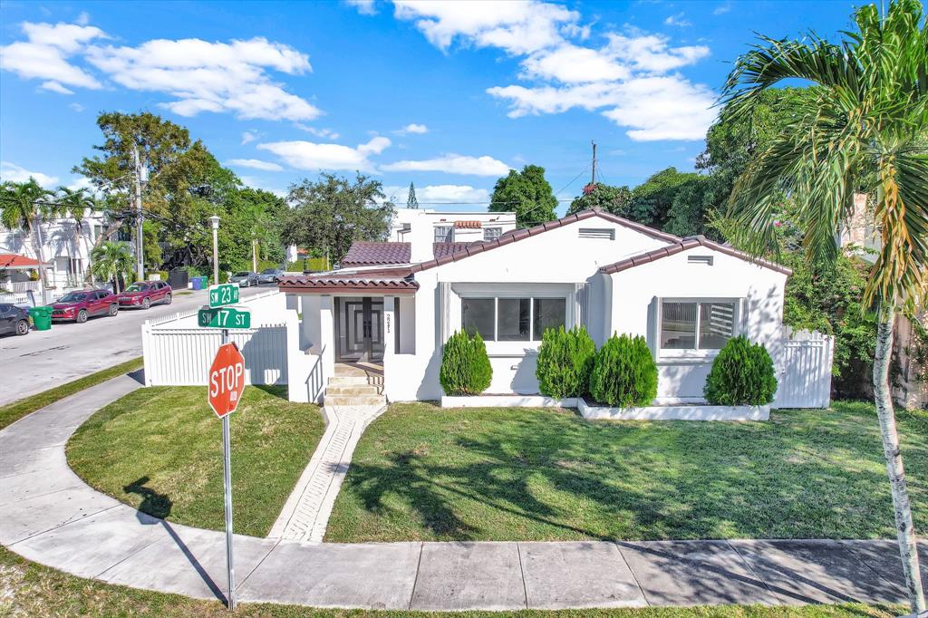 2291 Southwest 17th Street Miami, FL 33145 - Photo 4 of 86 a front view of house with yard and green space
