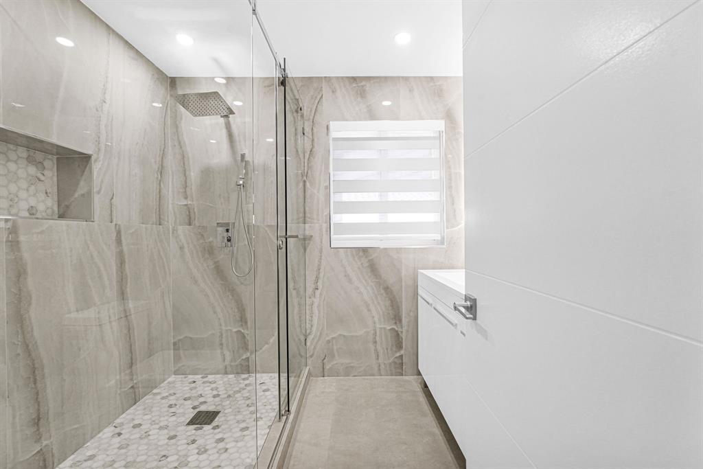 2291 Southwest 17th Street Miami, FL 33145 - Photo 51 of 86 a bathroom with a shower and a glass door