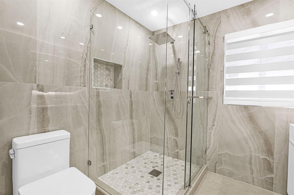 2291 Southwest 17th Street Miami, FL 33145 - Photo 52 of 86 a bathroom with a shower and a toilet