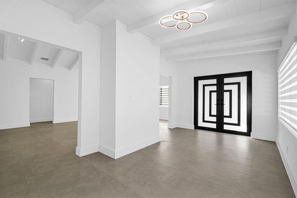 2291 Southwest 17th Street Miami, FL 33145 - Photo 60 of 86 an empty room with windows and ceiling fan