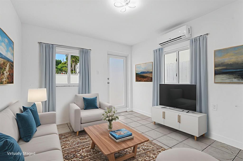 2291 Southwest 17th Street Miami, FL 33145 - Photo 73 of 86 a living room with furniture and a flat screen tv
