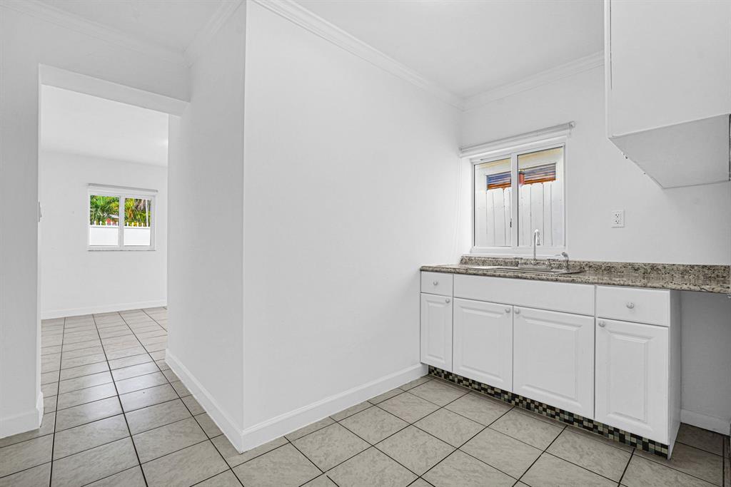 2291 Southwest 17th Street Miami, FL 33145 - Photo 75 of 86 a bathroom with a sink and a mirror