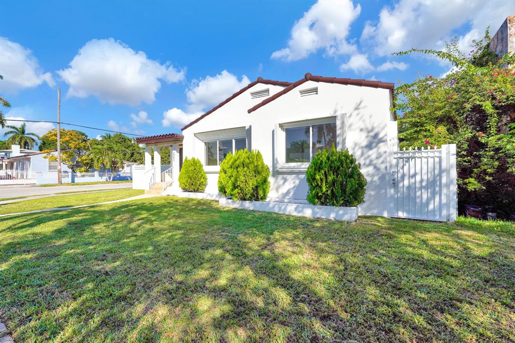 2291 Southwest 17th Street Miami, FL 33145 - Photo 82 of 86 a view of a house with a yard and a garden