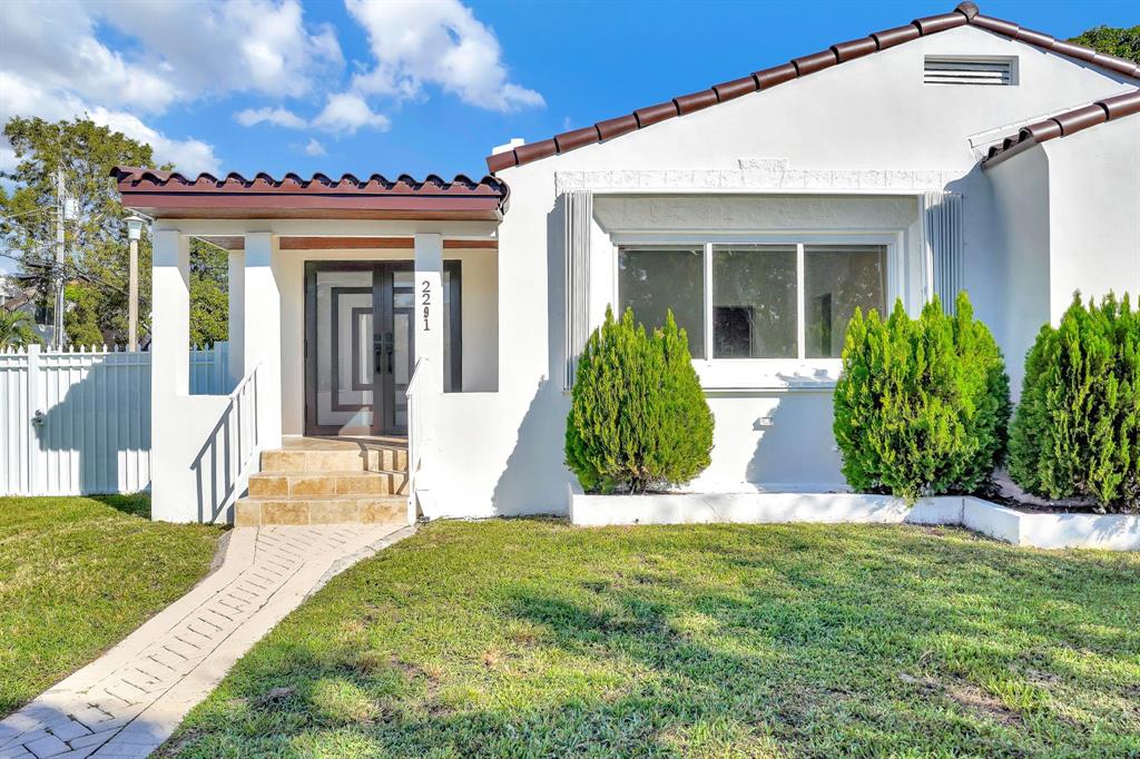 2291 Southwest 17th Street Miami, FL 33145 - Photo 83 of 86 a view of a house with a yard and plants