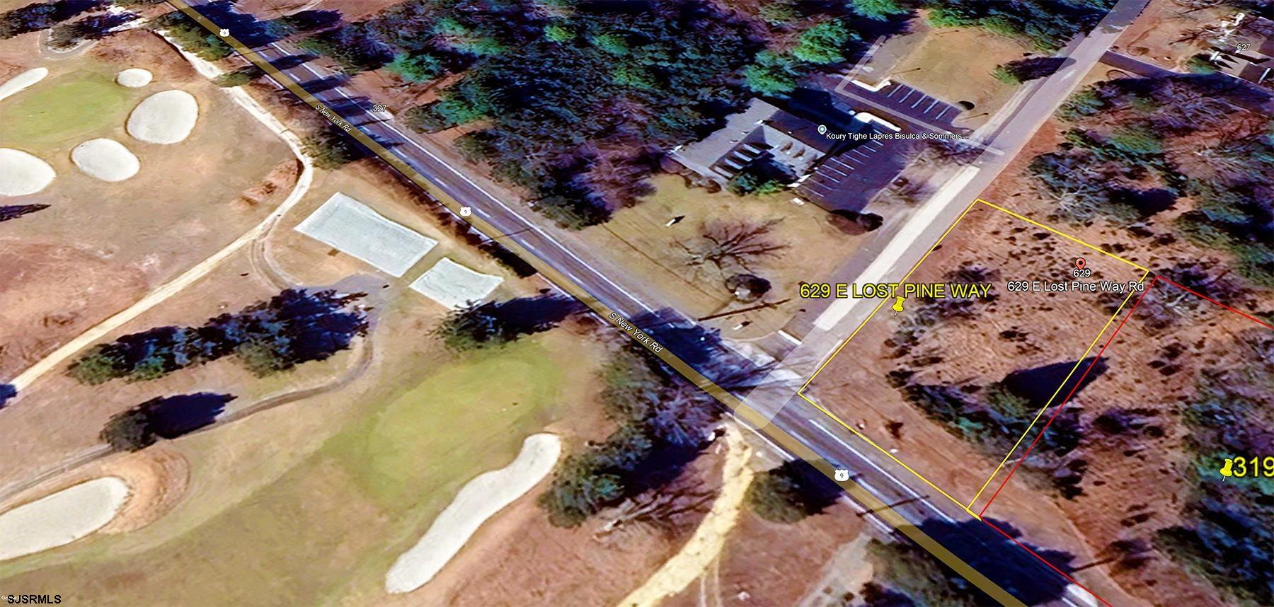 an aerial view of residential house with outdoor space