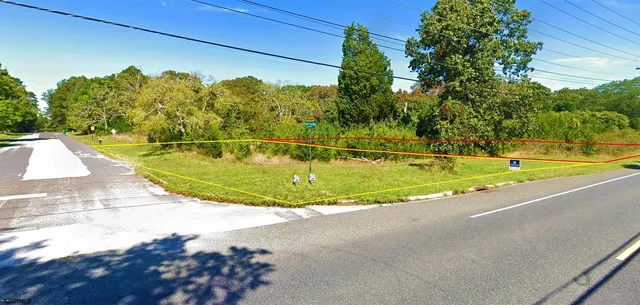 a view of a swimming pool with a yard