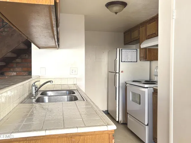 a kitchen with a stove and a sink