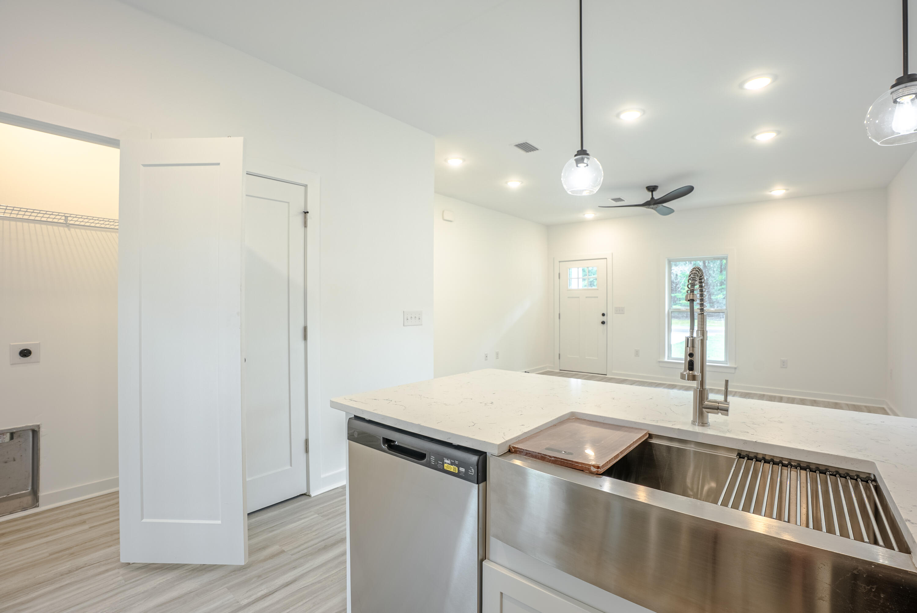 2351 Dumajack Road Chipley, FL 32428 - Photo 11 of 31 a kitchen with a sink and chandelier