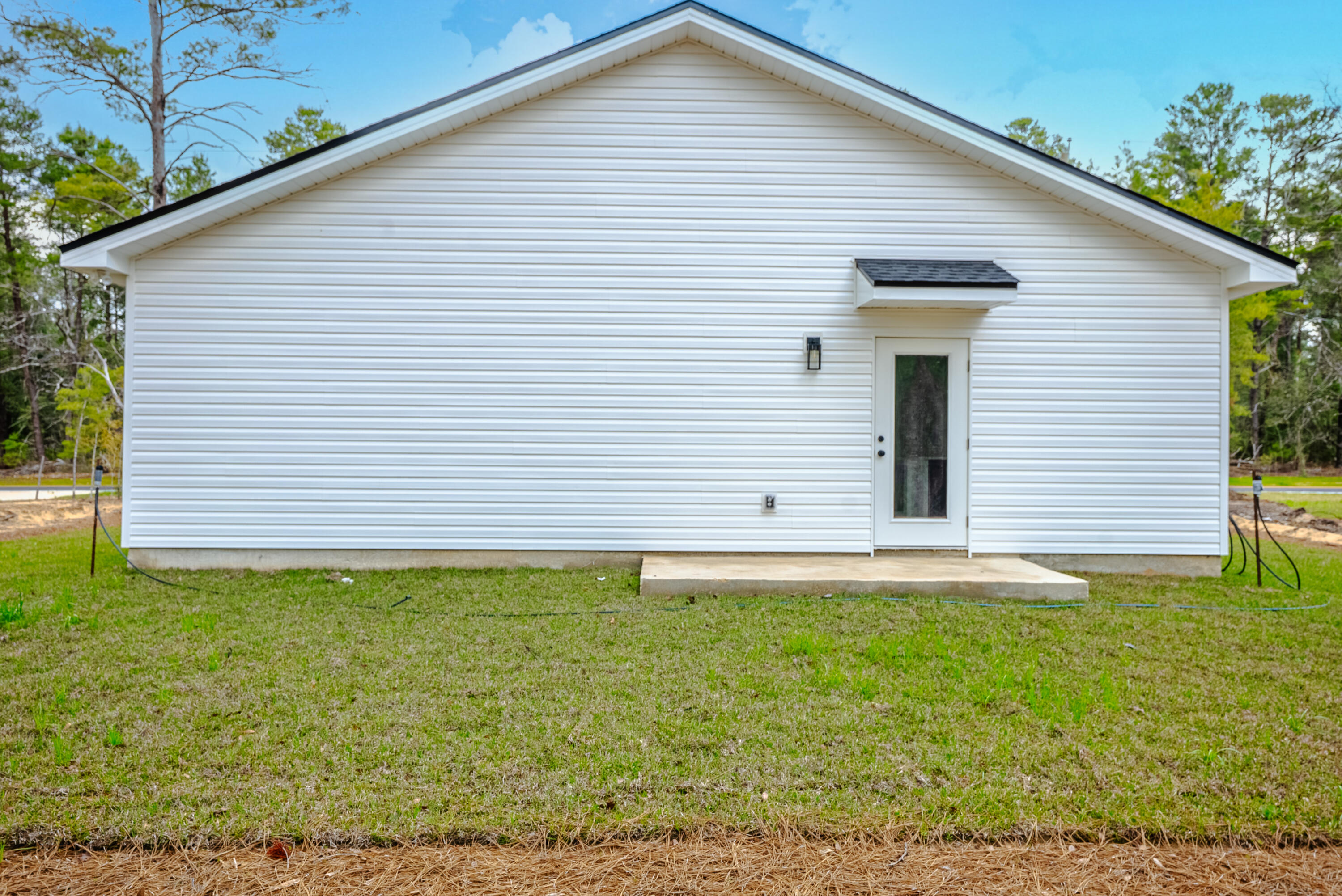2351 Dumajack Road Chipley, FL 32428 - Photo 20 of 31 a front view of a house with a yard