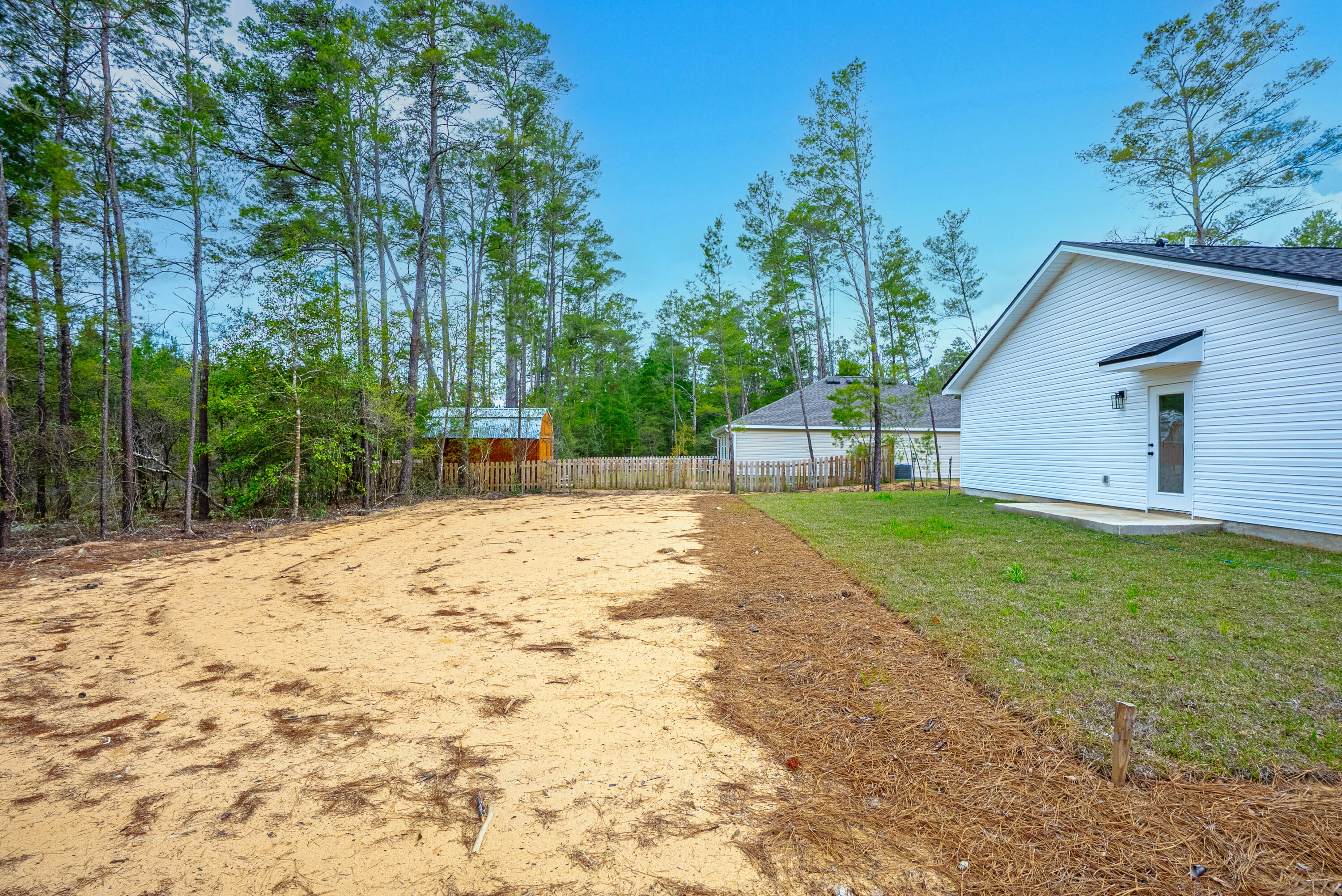 2351 Dumajack Road Chipley, FL 32428 - Photo 22 of 31 a view of a backyard with large trees