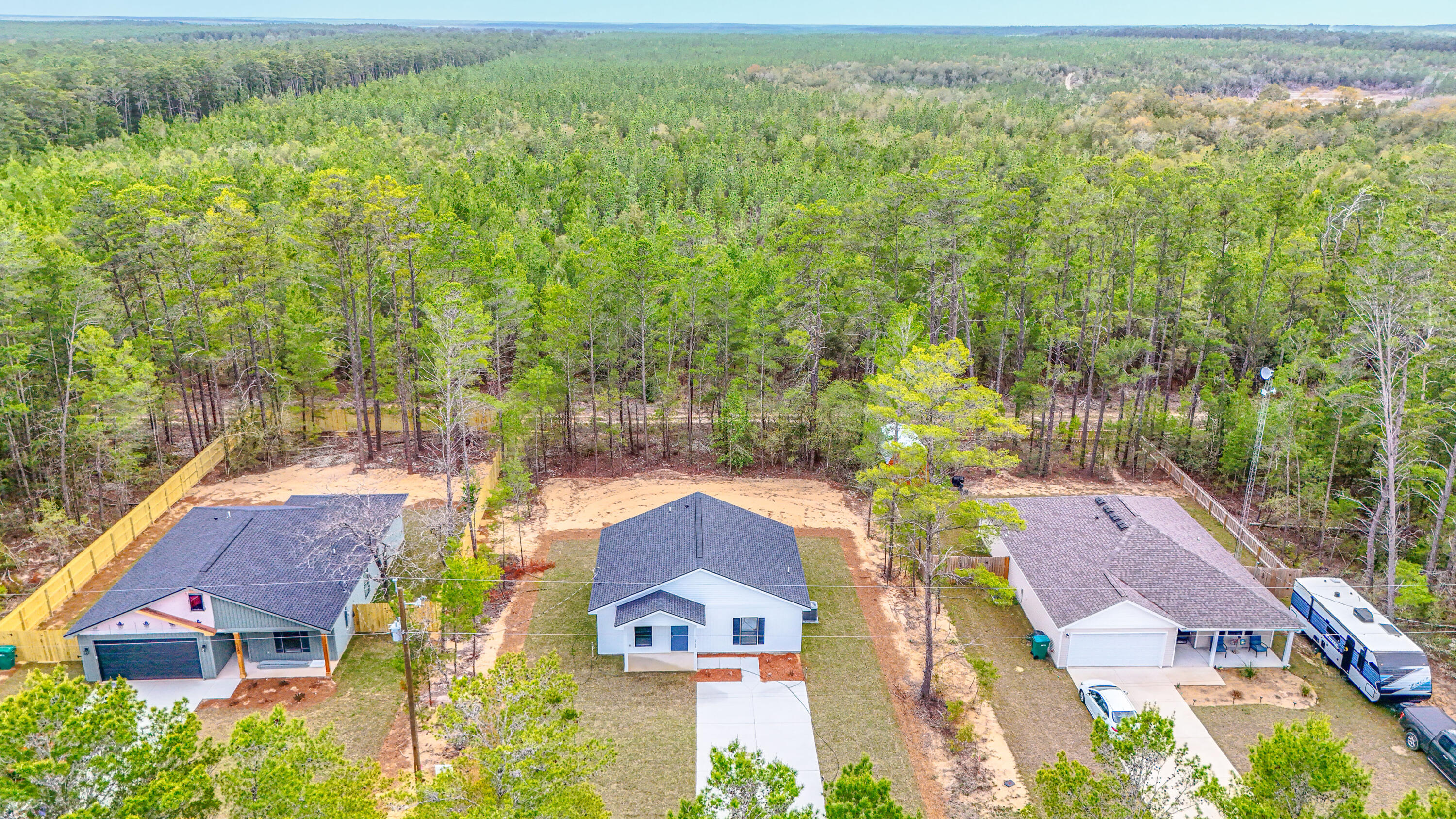 2351 Dumajack Road Chipley, FL 32428 - Photo 23 of 31 an aerial view of residential houses with outdoor space and trees