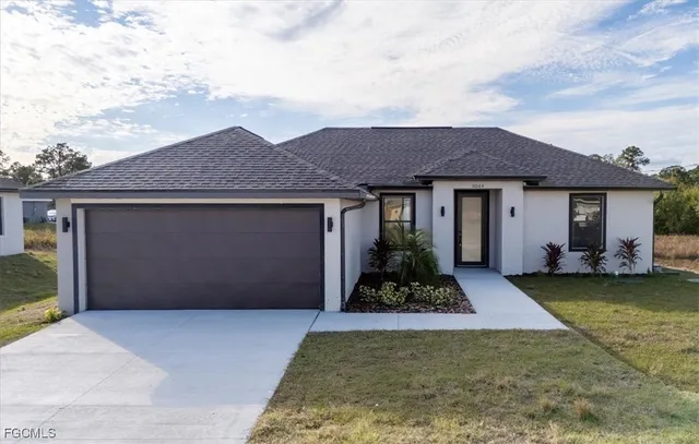 front view of a house with a yard