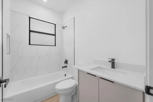 a bathroom with a sink toilet and bathtub