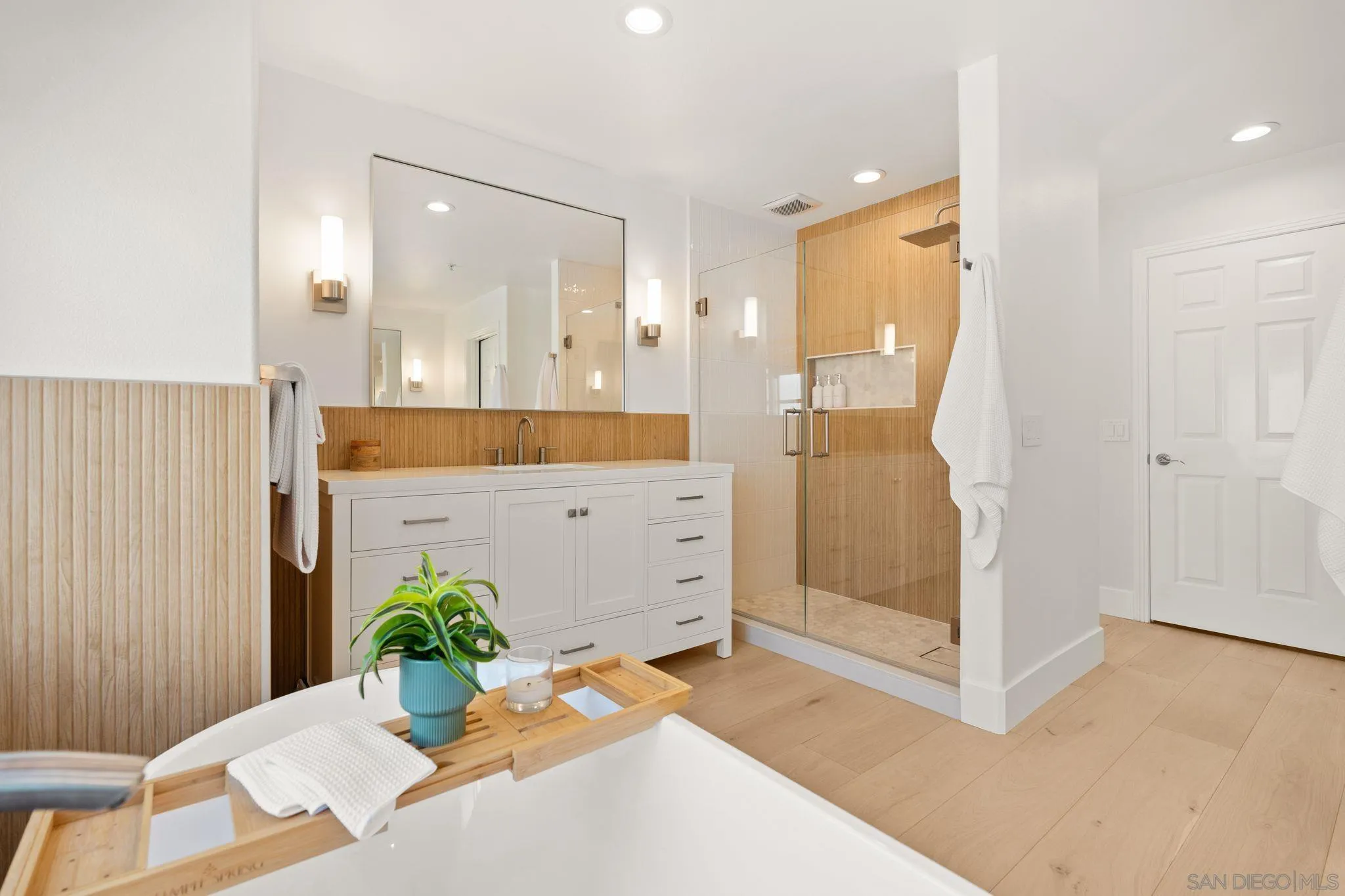 33671 Granada Drive, Unit 5 Dana Point, CA 92629 - Photo 14 of 25 a spacious bathroom with a tub shower and mirror