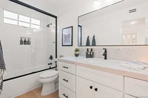 a dining room with furniture and chandelier