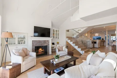 a living room with furniture fireplace and a flat screen tv