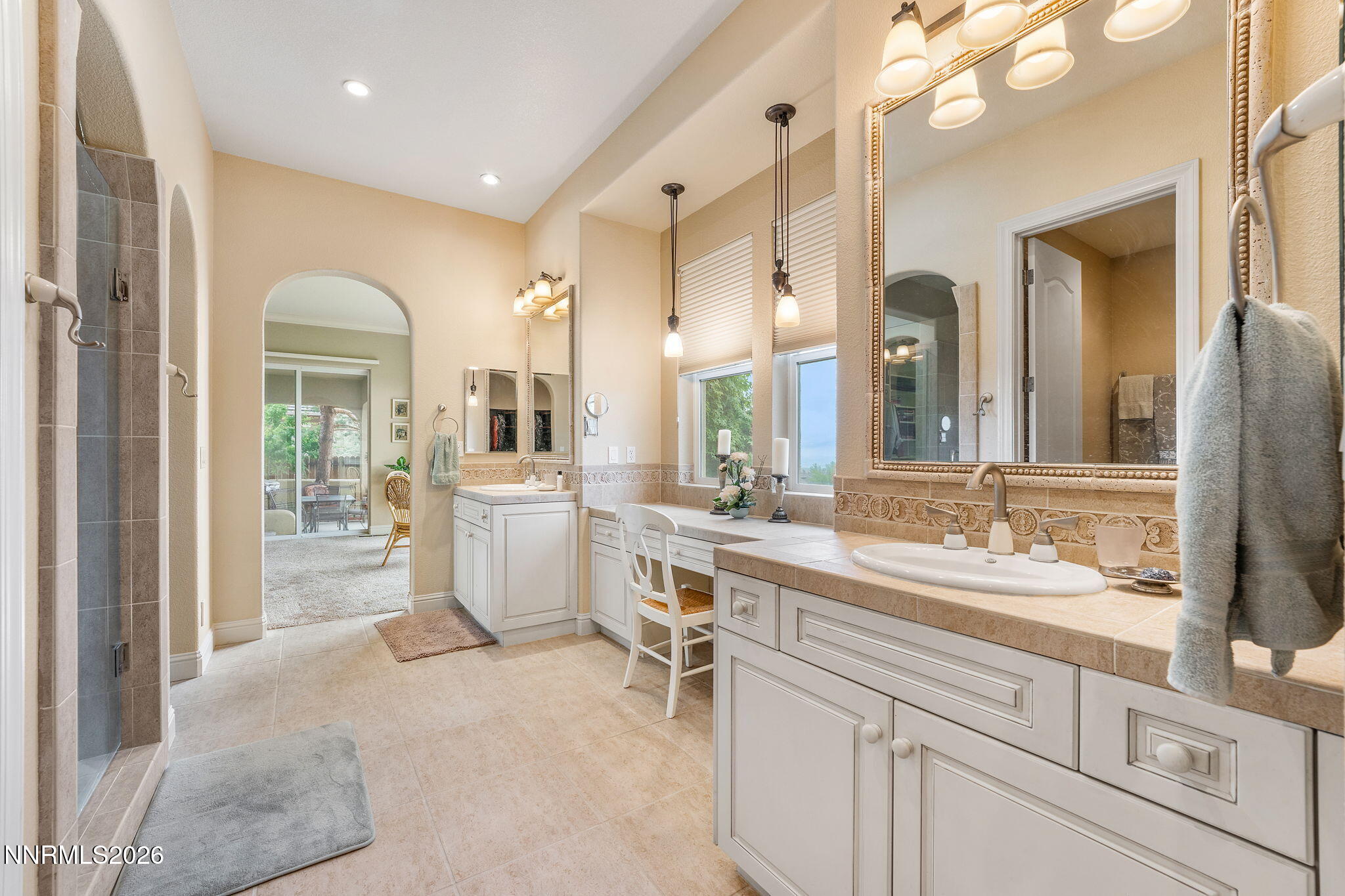 10170 Vía Como Reno, NV 89511 - Photo 23 of 85 a large white bathroom with a double vanity sink and a mirror
