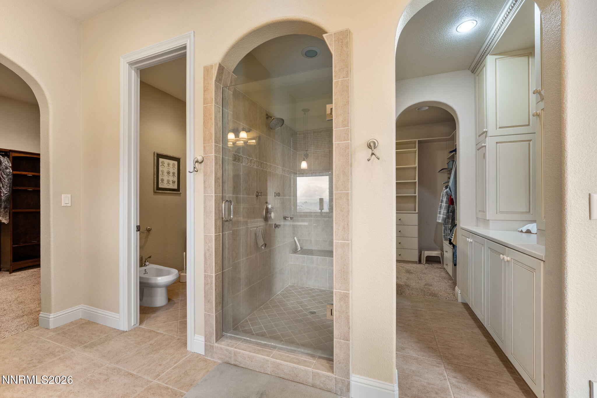 10170 Vía Como Reno, NV 89511 - Photo 25 of 85 a bathroom with a glass door shower