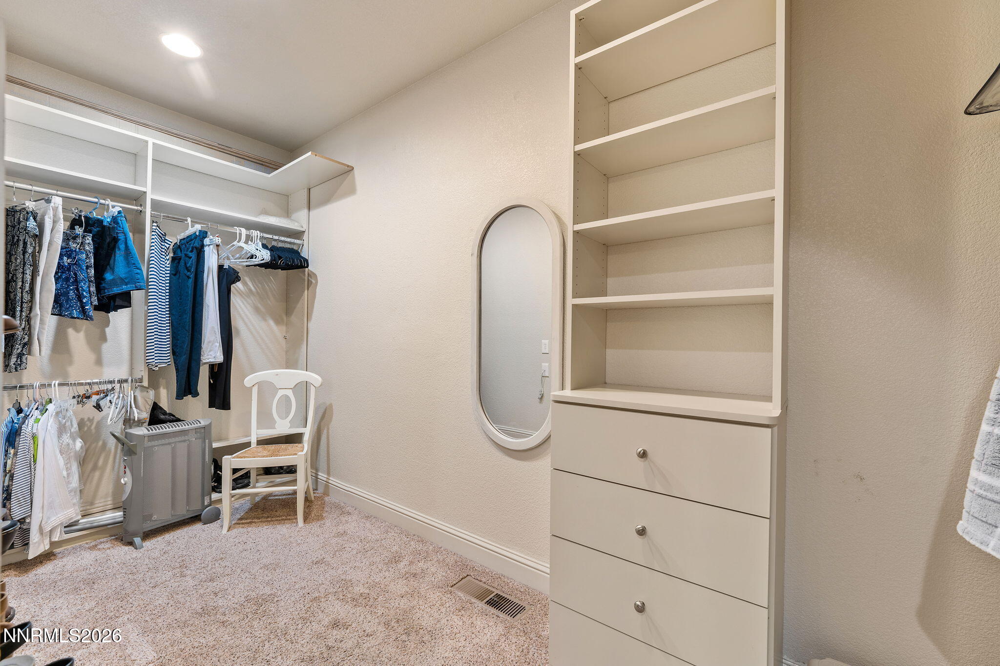 10170 Vía Como Reno, NV 89511 - Photo 27 of 85 a view of walk in closet with clothes and shoes