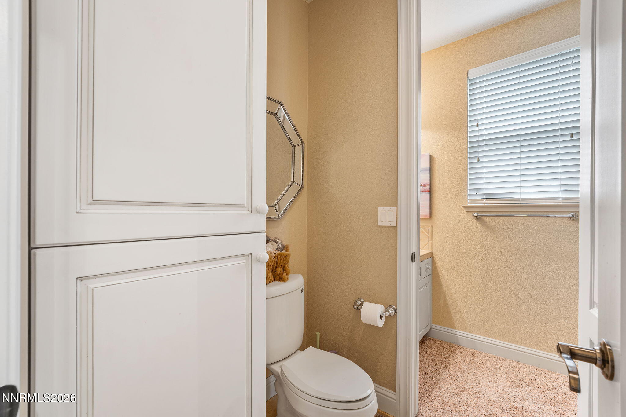 10170 Vía Como Reno, NV 89511 - Photo 36 of 85 a white toilet sitting next to a shower curtain