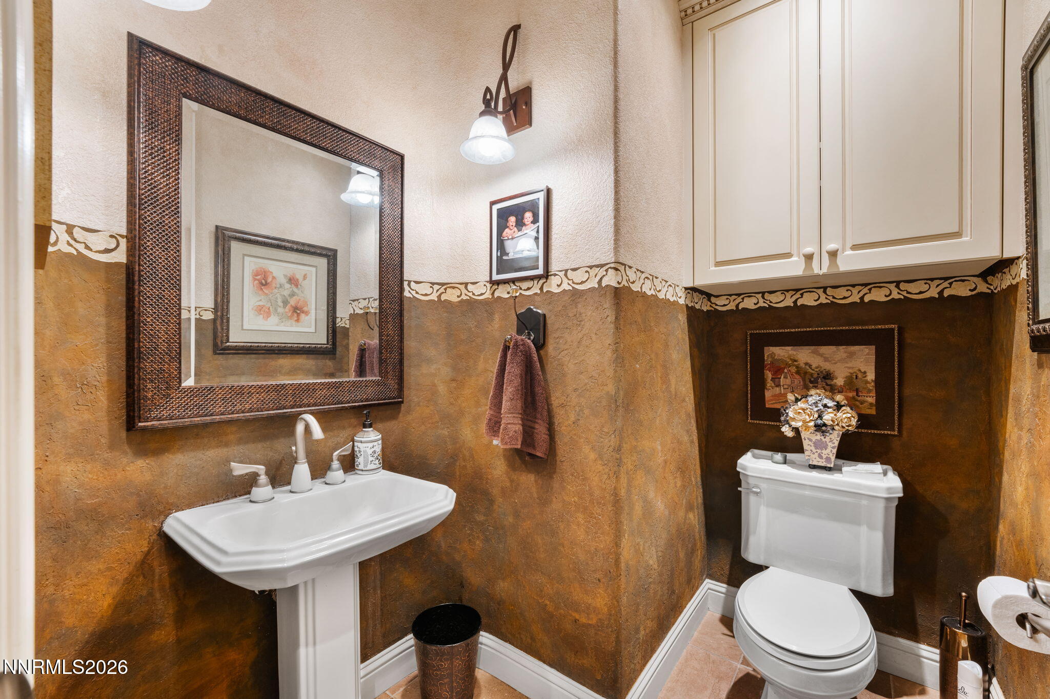 10170 Vía Como Reno, NV 89511 - Photo 38 of 85 a bathroom with a sink a toilet and mirror