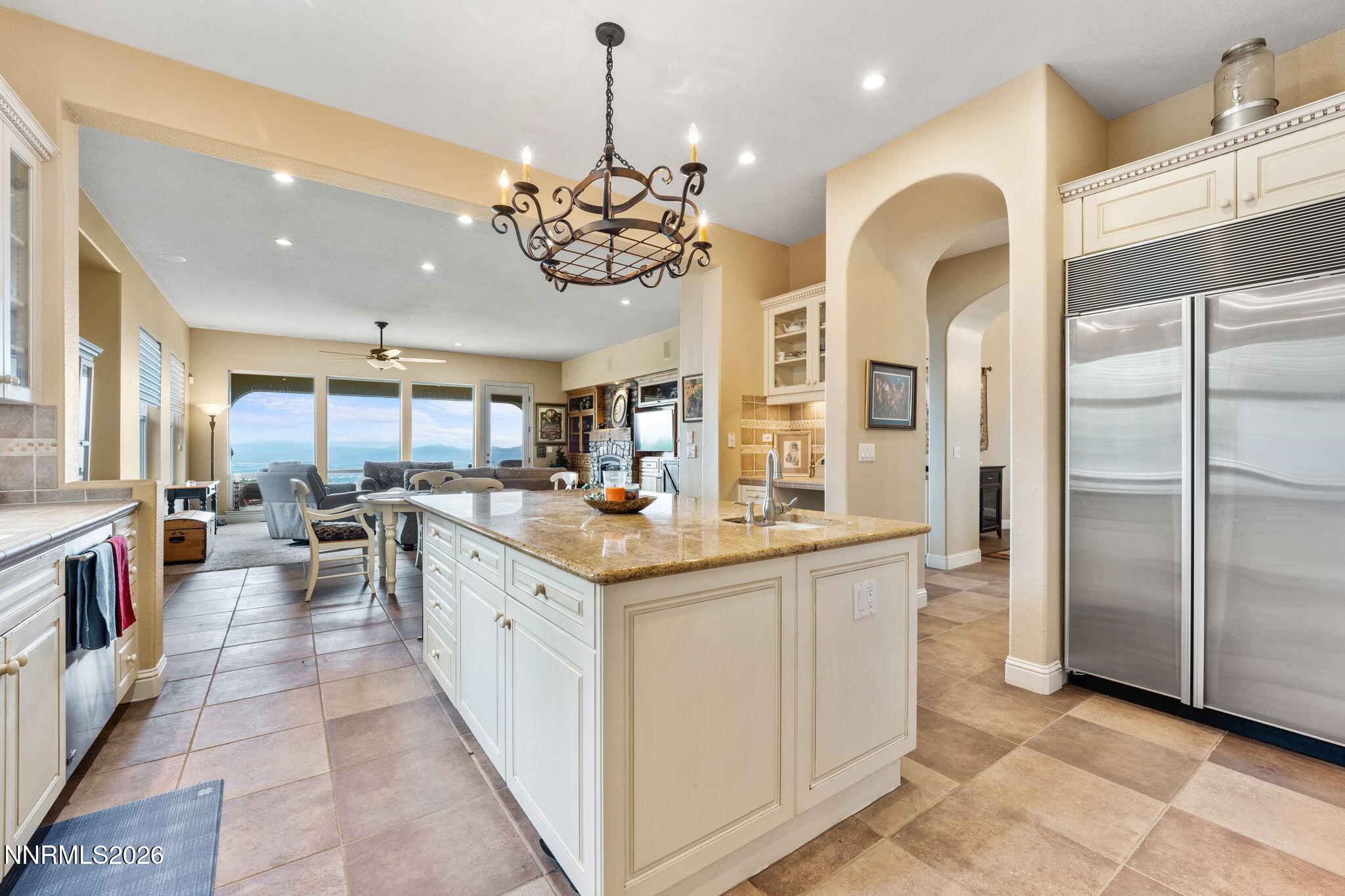 10170 Vía Como Reno, NV 89511 - Photo 8 of 85 a large kitchen with a counter space a sink appliances and living room