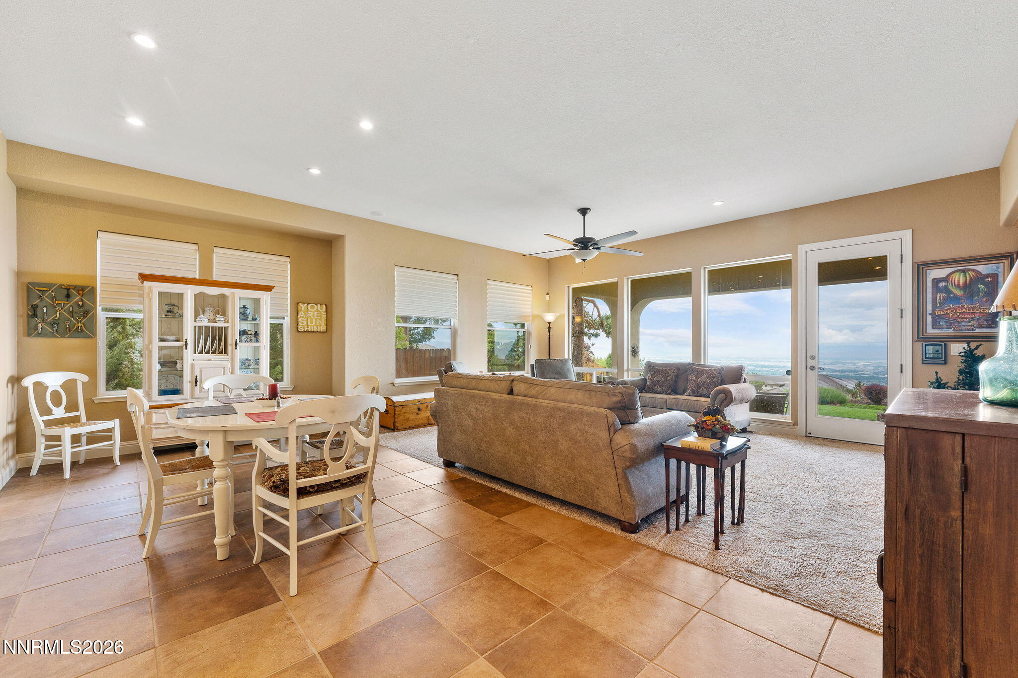 10170 Vía Como Reno, NV 89511 - Photo 10 of 85 a living room with furniture a large window and a table