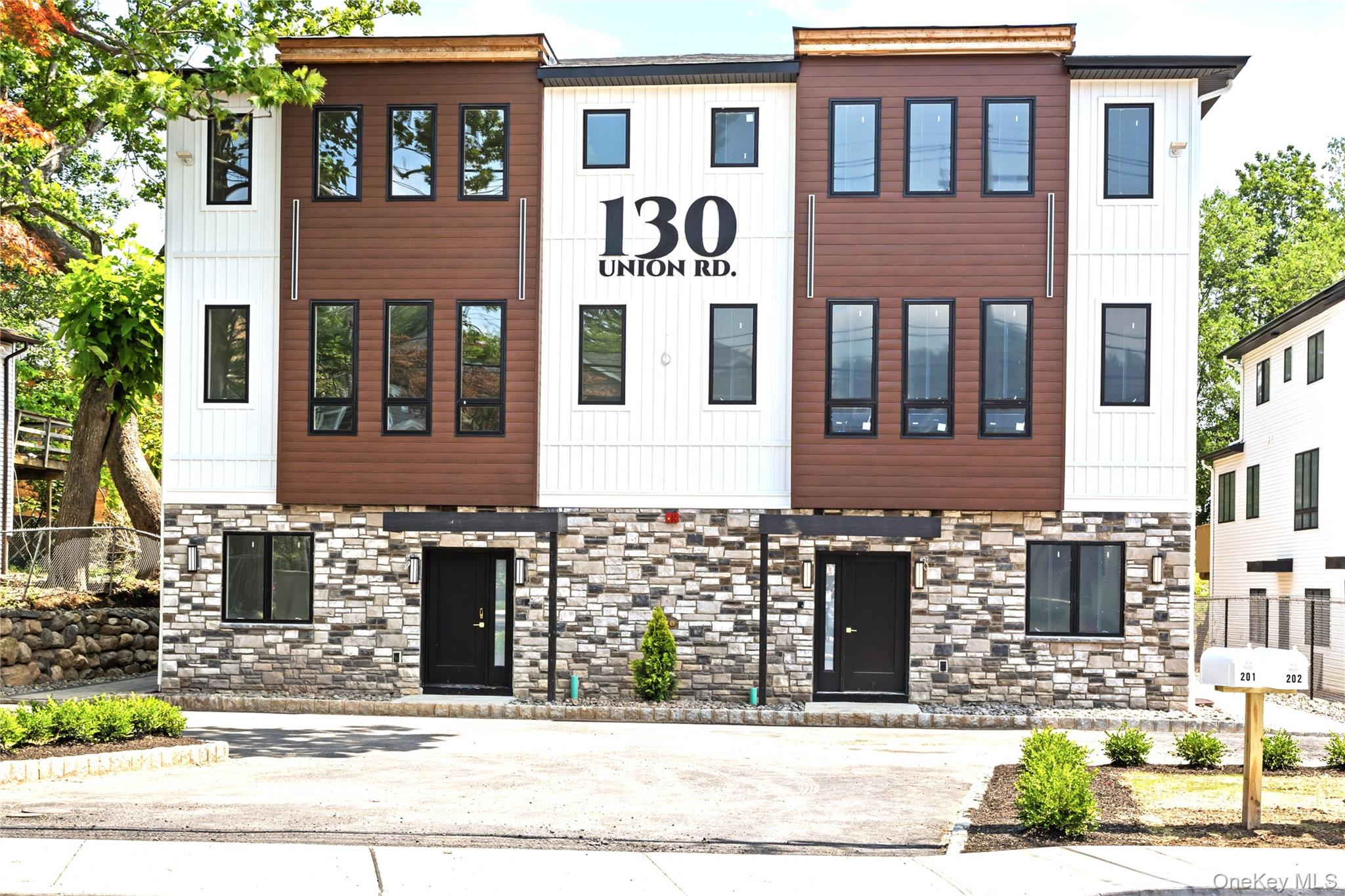 130 Union Road, Unit 201 Spring Valley, NY 10977 - Photo 2 of 47 a front view of a house