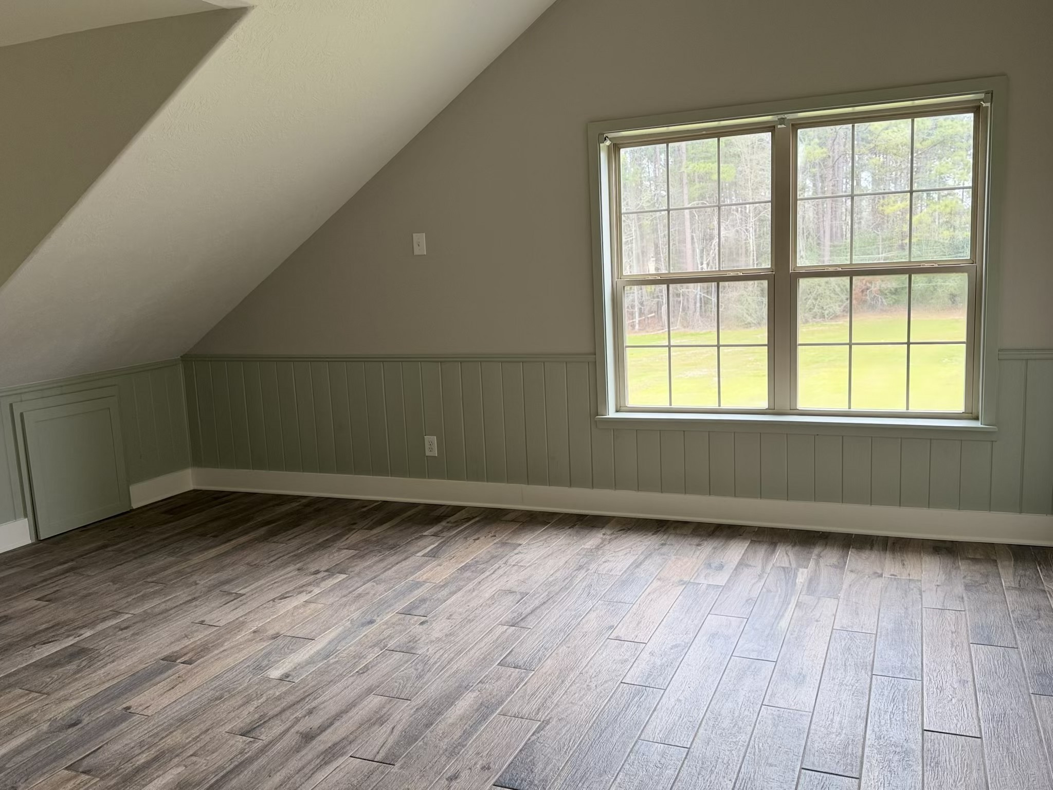 335 Walding Road Livingston, TX 77351 - Photo 15 of 23 an empty room with wooden floor and windows