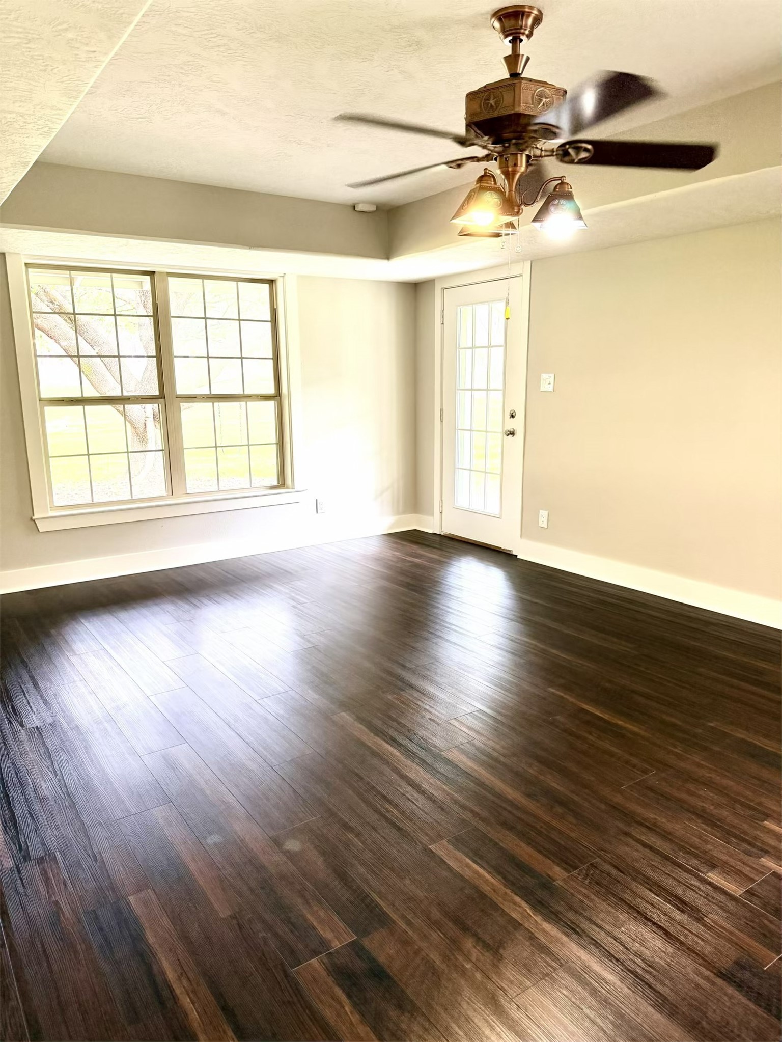 335 Walding Road Livingston, TX 77351 - Photo 8 of 23 a view of an empty room with wooden floor and a window
