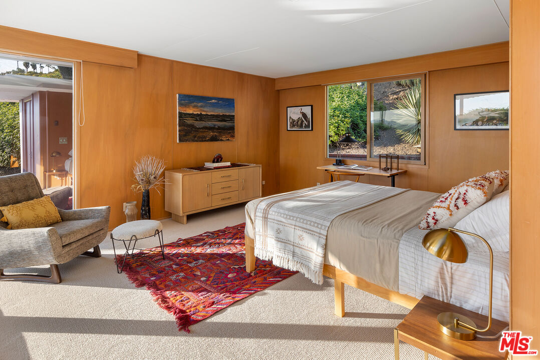 526 Hunter Drive Fillmore, CA 93015 - Photo 15 of 32 a bedroom with a bed and wooden floor