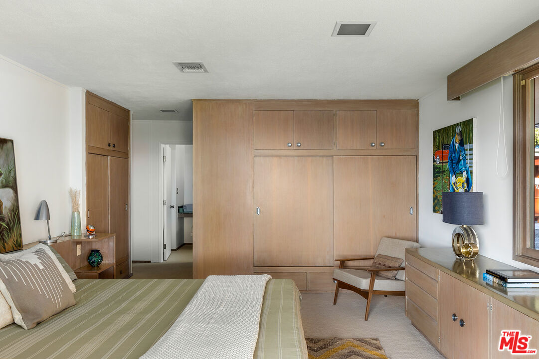 526 Hunter Drive Fillmore, CA 93015 - Photo 20 of 32 a bedroom with a bed and a couch