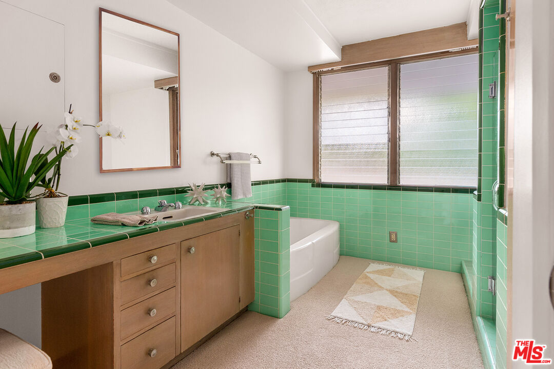 526 Hunter Drive Fillmore, CA 93015 - Photo 21 of 32 a bathroom with a double vanity sink and a mirror