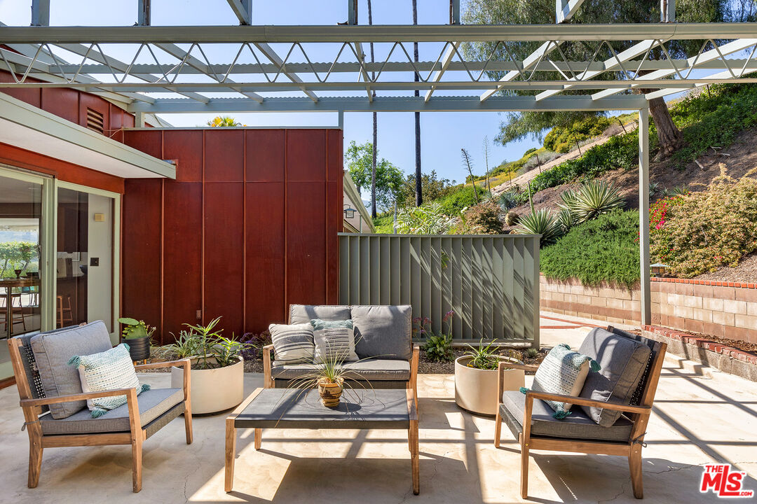 526 Hunter Drive Fillmore, CA 93015 - Photo 6 of 32 a view of a patio with a dining table and chairs with wooden floor