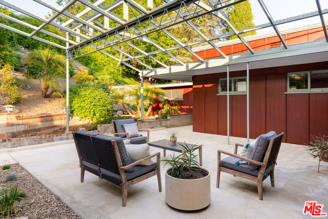 526 Hunter Drive Fillmore, CA 93015 - Photo 8 of 32 a building outdoor space with patio furniture and potted plants