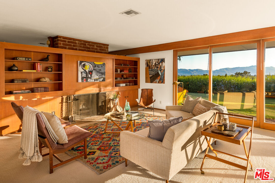 526 Hunter Drive Fillmore, CA 93015 - Photo 10 of 32 a living room with furniture a floor to ceiling window and floor to ceiling windows