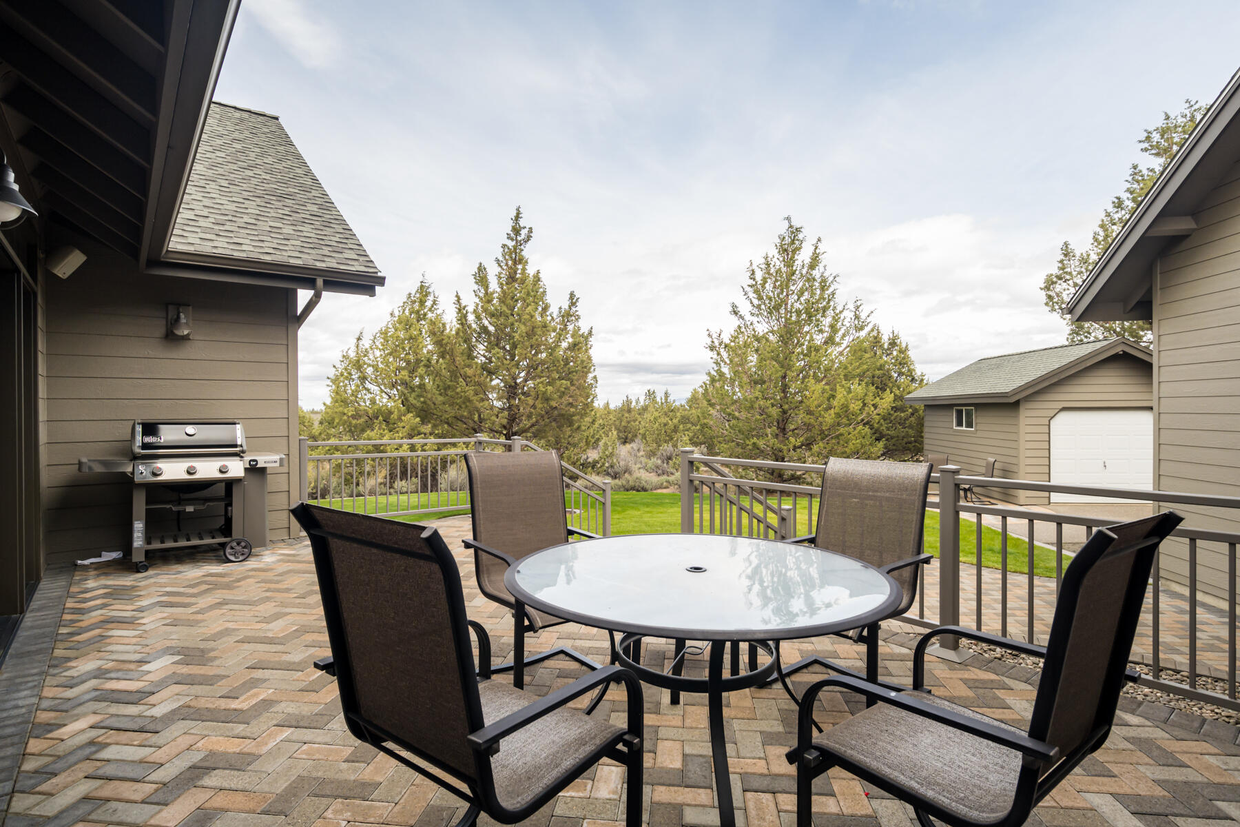 60850 Jennings Road Bend, OR 97702 - Photo 45 of 52 a view of a chairs and table in the back yard