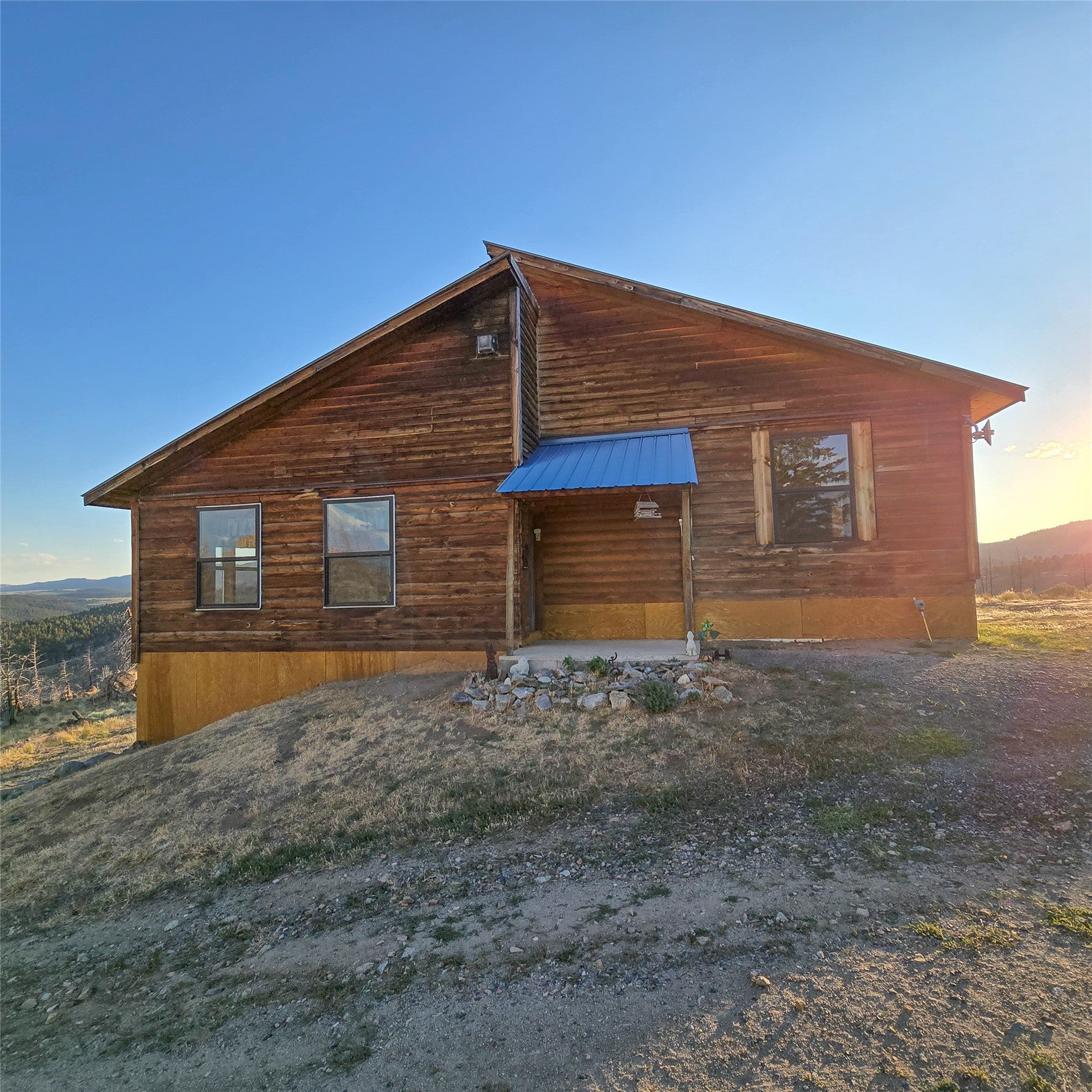 210 Friendspring Road Whitehall, MT 59759 - Photo 12 of 43 View of side of property featuring a metal roof
