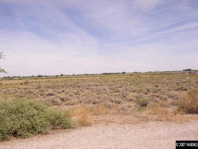7580 Sandhill Road Fallon, NV 89406 - Photo 4 of 6 a view of a large body of water with a city in the background