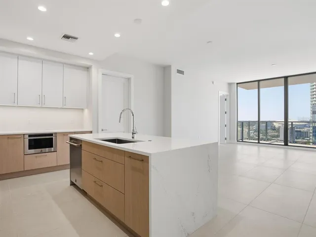 an empty room with sliding glass door and glass door